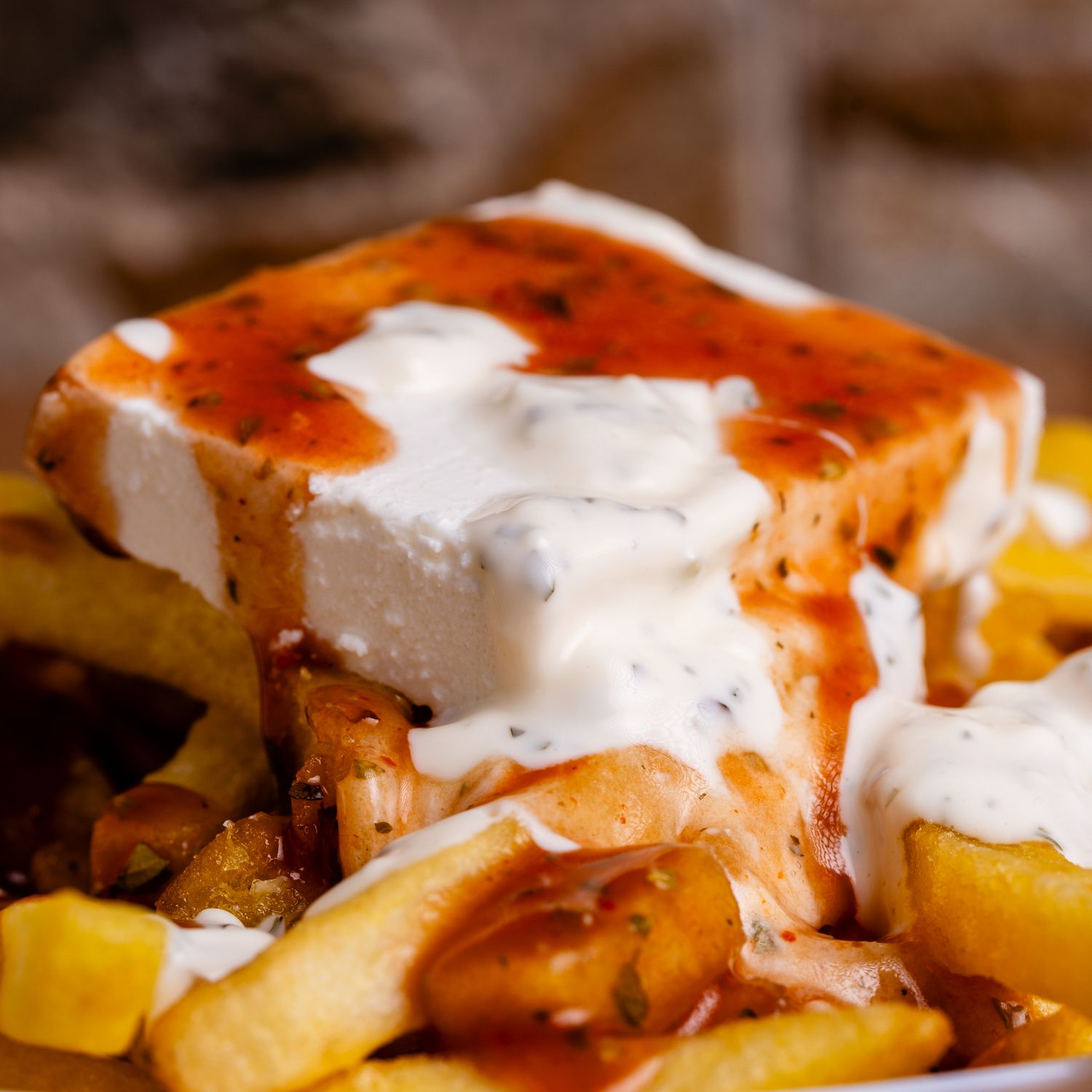 Loaded fries piled high with pulled pork and cheddar.